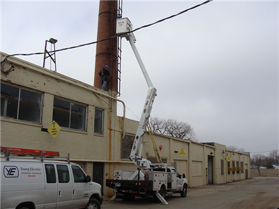 Young Electric truck performing commercial electrical work